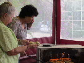 Shosh showing Mitzy how to make pita